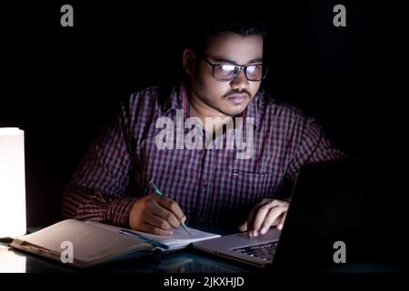 business person working overtime at late night using computer Stock Photo
