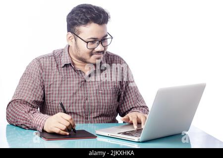 photoshop editor or retoucher drawing on illustrator with digital graphic tablet and stylus pen on laptop Stock Photo