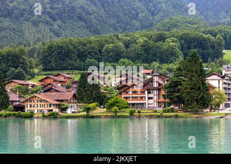The traditional cottages on the shore of Lake Brienz. Interlaken, Switzerland. Stock Photo
