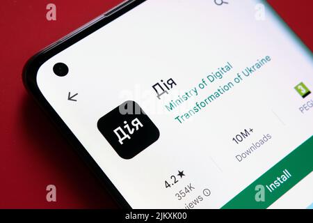 DIia app on smartphone screen. Ukrainian words seen on photo translate as "Action", "Action app". "Diia" app is the State in Smartphone project. Staff Stock Photo