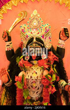 Idol of Maa Kali in a village pandal. Maa kali is the Hindu goddess of death, time, and doomsday Stock Photo