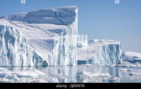 Towering great icebergs in the Ilulissat Icefjord in Greenland Stock Photo