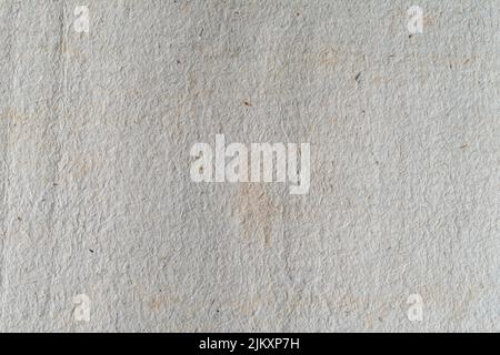 A macro focus shot of an old white handmade paper texture in bright light Stock Photo