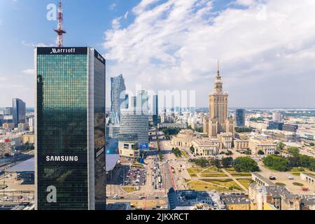 7.22.2022 Warsaw, Poland. Centrum LIM on the foreground, Palace of Culture and Science and other famous skyscrapers in the background. Sunny weather. Aerial shot. High quality photo Stock Photo