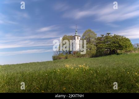 A beautiful shot of St. Michael's Chapel on the Michaelsberg against blue sky on a sunny day near Bruchsal, Germany Stock Photo