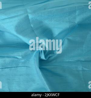 A closeup shot of a turquoise blue dupioni fabric - perfect for wallpapers Stock Photo