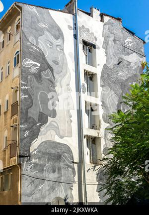 Street art, mural by Turkish muralist Ares Badsector male and female faces, black and white, Kadiköy district of Istanbul, Turkey Stock Photo