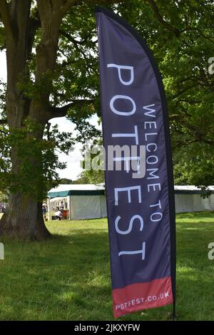 A flag at the ceramics exhibition Potfest in the Park at Hutton-in-the-Forest House. Stock Photo