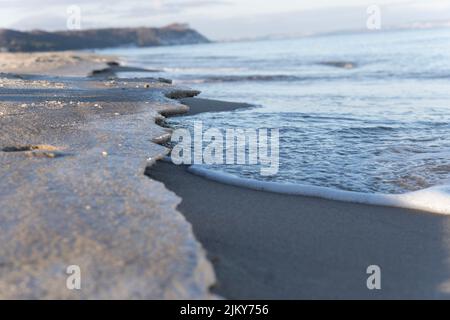 A sandy beach with ice Stock Photo