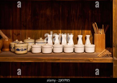 Sideboard and utensils in traditional Chinese restaurant Stock Photo