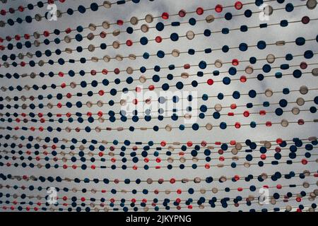 A closeup shot of bottle caps on a rope Stock Photo