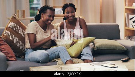 My best friend is my special person for life. two friends relaxing and hanging out on the couch at home. Stock Photo