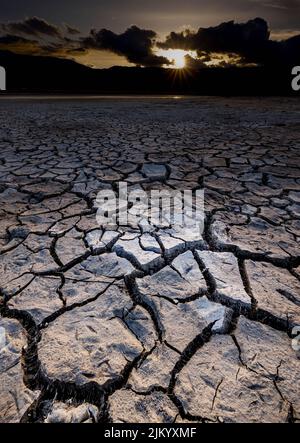 Cracks from a dry lake bed in Washoe Valley draw its way across the landscape Stock Photo