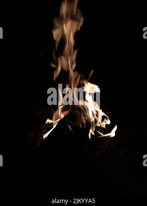 A closeup of a fire isolated on a black background Stock Photo