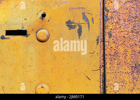 Detail of a metal plate on an antique tractor Stock Photo