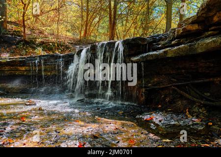 a closeup shot of small waterfall in river Stock Photo