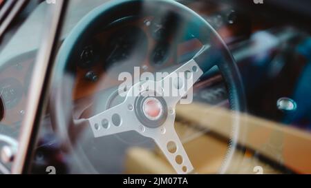 A closeup shot of a vintage car steering wheel Stock Photo