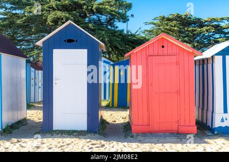 Wooden beach cabins on the Oleron island in France, colorful huts Stock Photo