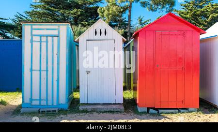 Wooden beach cabins on the Oleron island in France, colorful huts Stock Photo