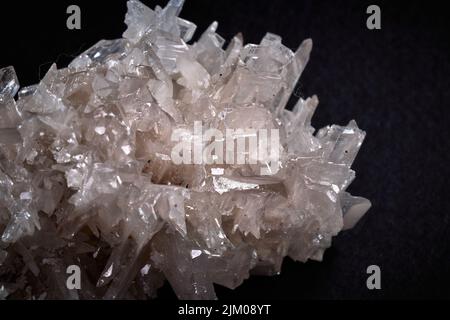 A closeup of a rare mineral row uncut white crystal Stock Photo