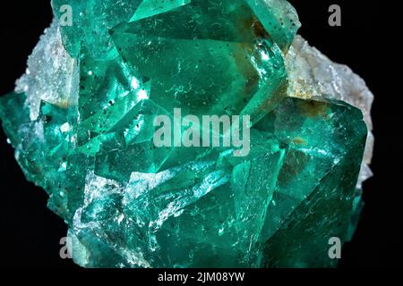 A closeup of a rare mineral row uncut green crystal Stock Photo