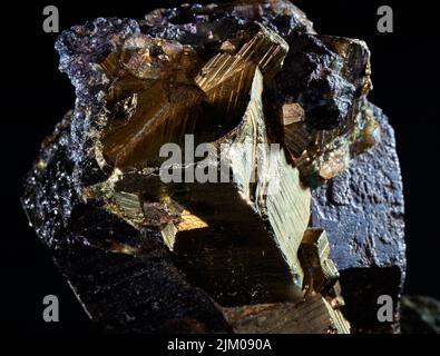 A closeup of a rare mineral row uncut golden crystal Stock Photo