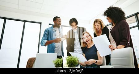 Happy, creative and cheerful business people, in marketing meeting, excited with presentation. Colleagues working on advertising ideas in modern Stock Photo
