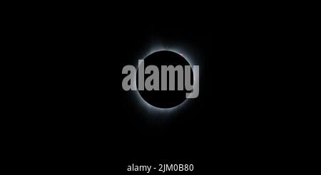 A view of the solar eclipse in a dark sky over Madras, Oregon Stock Photo