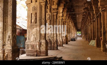 Corridor with carved pillars of Pudhu Mandapam, Meenakshi Amman Temple, Madurai, Tamilnadu, India. Stock Photo