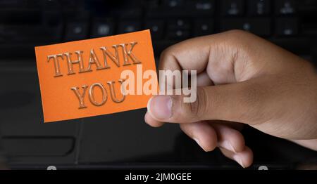 THANK YOU, message on the card in 3d style  shown by a businesswoman Stock Photo
