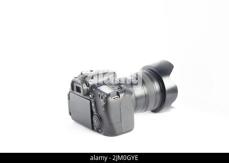 A closeup of a camera on a white surface Stock Photo