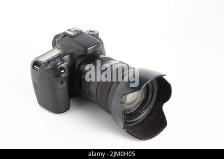 A closeup of a camera on a white surface Stock Photo