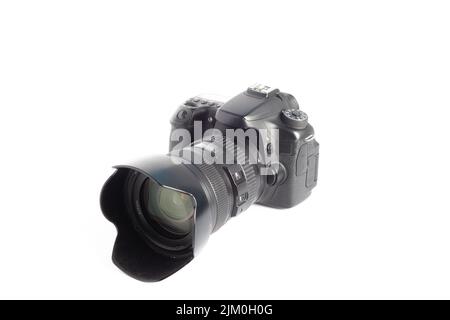 A closeup of a camera on a white surface Stock Photo