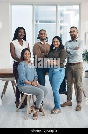 This is the team that constantly succeeds. Full length portrait of a diverse group of businesspeople posing together in the office during the day. Stock Photo