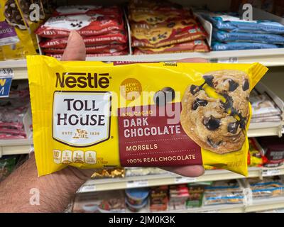 Augusta, Ga USA - 04 15 22: Nestle Morsels in a retail store hand holding dark chocolate Stock Photo