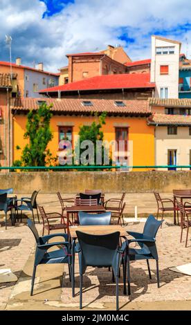 Tables at one of many outdoor cafes in Casco Viejo, the historic Old Town Pamplona, Spain famous for running of the bulls Stock Photo