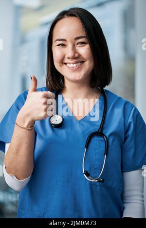 Youre looking much better already. Portrait of a medical practitioner showing thumbs up in a hospital. Stock Photo