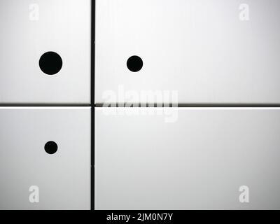 Three black circles on four white squares Stock Photo