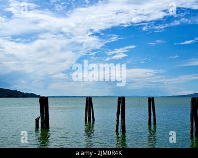 beautiful sky reflecting on trasimeno lake in central italy on a hot summer afternoon Stock Photo
