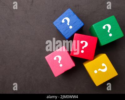 Top view colored cube with question mark and exclamation mark symbol on ...