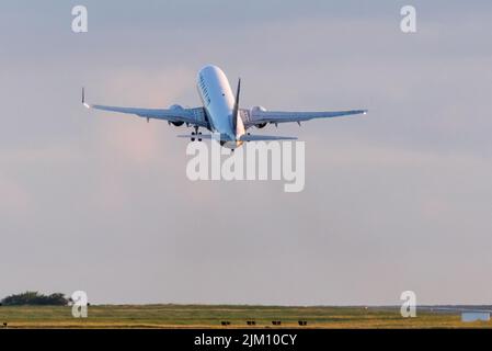 Cork Airport, Cork, Ireland. 04th August, 2022. A Ryanair Boeing 737 takes off for an early morning flight to  Poznan from Cork Airport, Ireland.- Credit; David Creedon / Alamy Live News Stock Photo