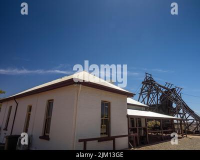 Old mine buildings and poppet head at Gwalia Museum, Western Australia Stock Photo