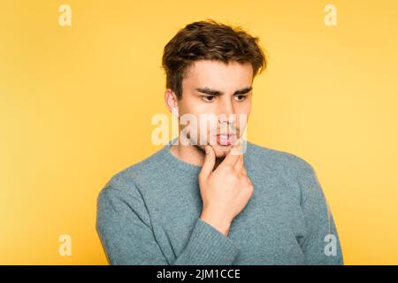 puzzled bewildered man think scratch beard emotion Stock Photo