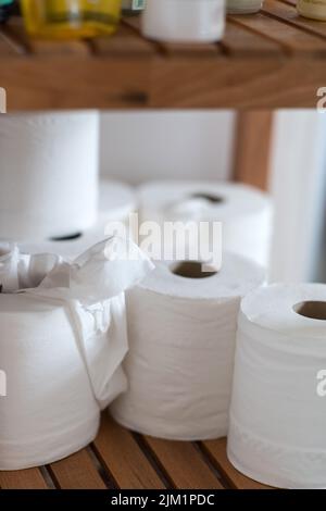 Toilet rolls ion bathroom shelf Stock Photo