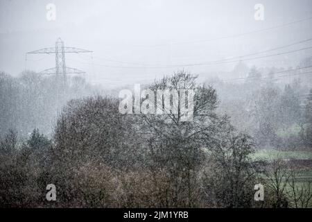 Electricity pylons in winter snow Stock Photo - Alamy