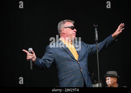 Lead Singer, Graham McPherson, known by his stage name Suggs, performs all the Hits with his Band Madness at Tramlines Festival in Sheffield. Stock Photo