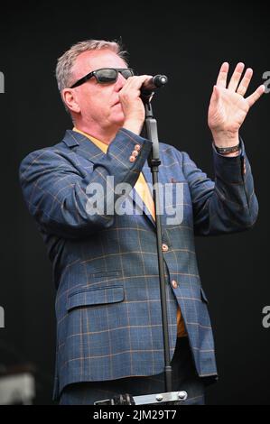 Lead Singer, Graham McPherson, known by his stage name Suggs, performs all the Hits with his Band Madness at Tramlines Festival in Sheffield. Stock Photo