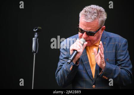 Lead Singer, Graham McPherson, known by his stage name Suggs, performs all the Hits with his Band Madness at Tramlines Festival in Sheffield. (Photo by Robin Burns / SOPA Images/Sipa USA) Stock Photo