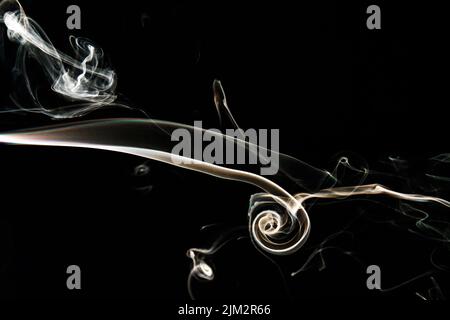 Smoke effect texture. Isolated background. Black and dark backdrop. Smokey fire and mistic effect. Spirit wave. Photo realistic mist stock image. Stock Photo