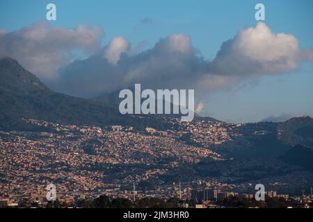 A mesmerizing view of beautiful Bogota cityscape with mountains in the ...